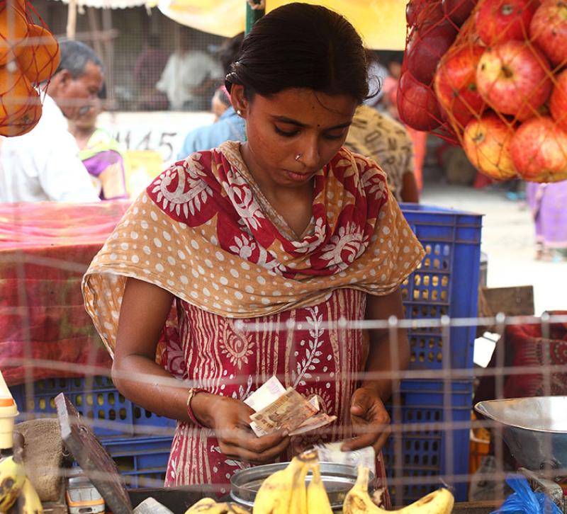 Young girl shopping for fruit