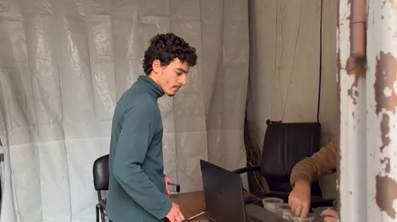 Student paying for internet access (from the film 'Our Universities Live On: Testimonials of Hope from Gaza')