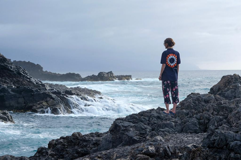 Laura Ballerini standing on rocks looking out over a seascape