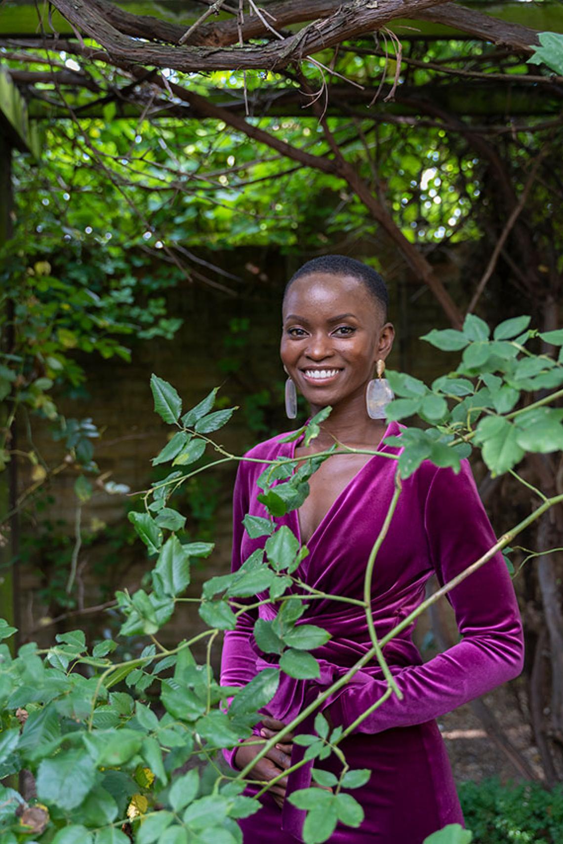 Marion Osieyo surrounded by leaves