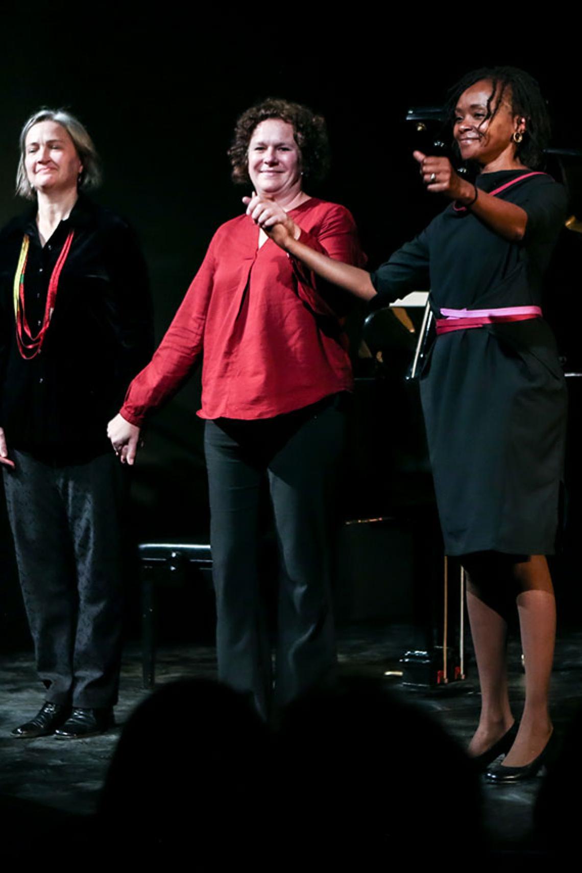 Clare Loveday, Mareli Stolp and Caroline Wanjiku Kihato receiving applause