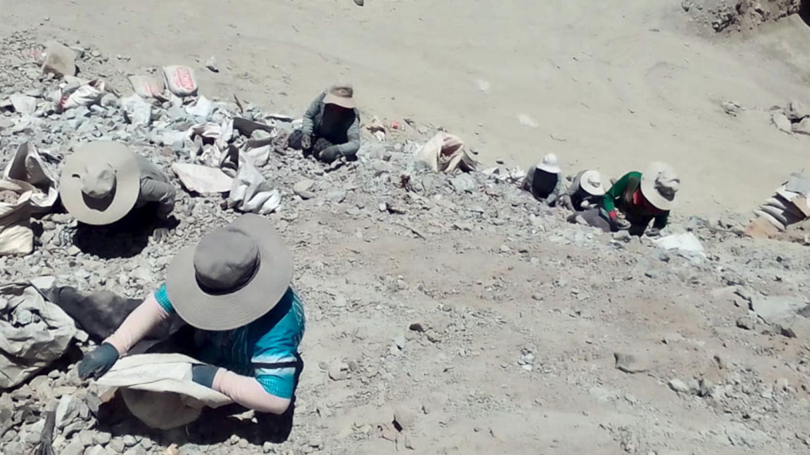 Miners working on a rock face