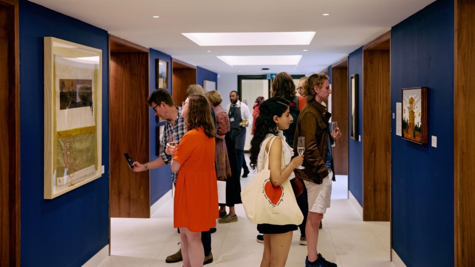 People viewing the Entangled exhibition at the launch in June 2024